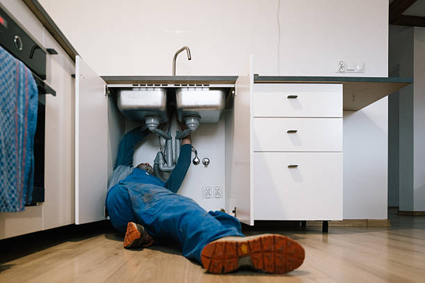 Professional Emergency Plumber technician working in Memphis, IN